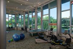 The Glenview at Pelican Bay Rehab Wellness Exercise Room Healthcare Florida Senior Living THW Design