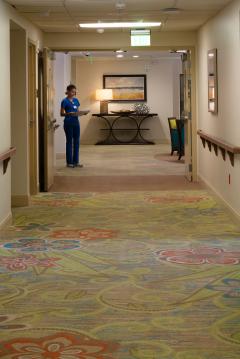 The Glenview at Pelican Bay Nurse Cooridor Healthcare Florida Senior Living THW Design